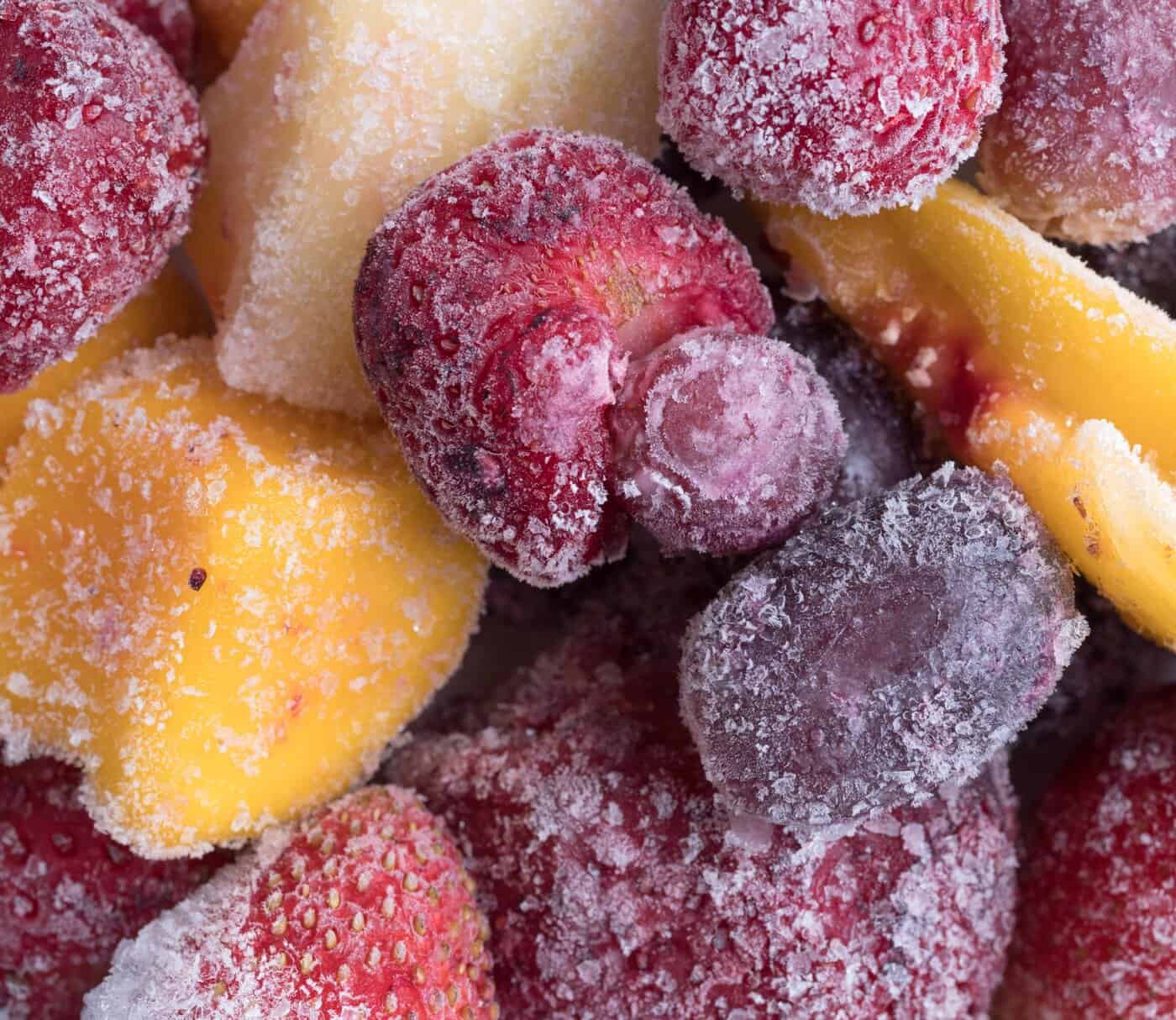  Frozen fruit mix showing strawberries, mango slices, used in GrandFusion blends. 
