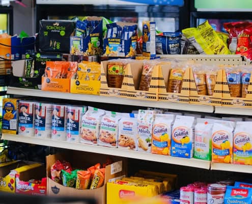 This photo features ultra processed foods on the shelves at a grocery