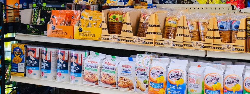 This photo features ultra processed foods on the shelves at a grocery