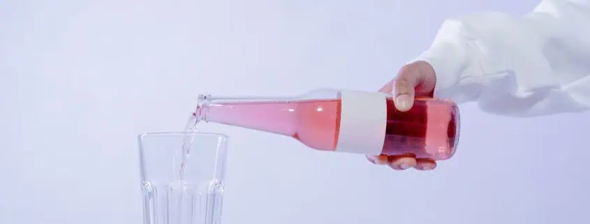 This photo shows a drink for gut health being poured into a glass