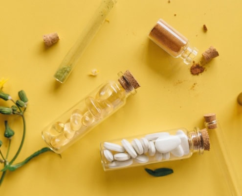This photo features vitamin e supplements in vials