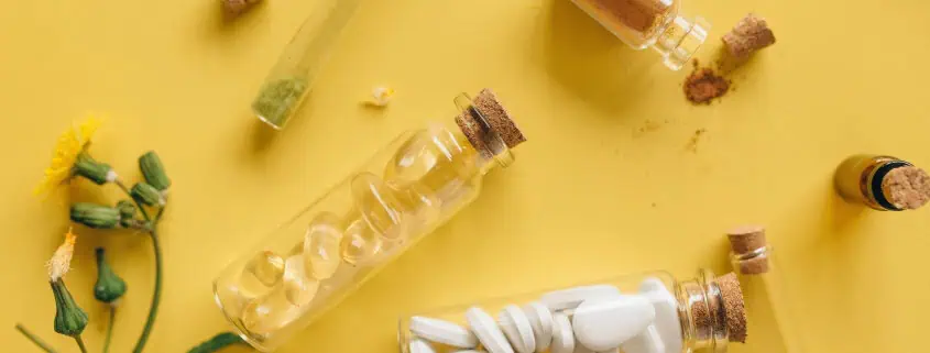 This photo features vitamin e supplements in vials